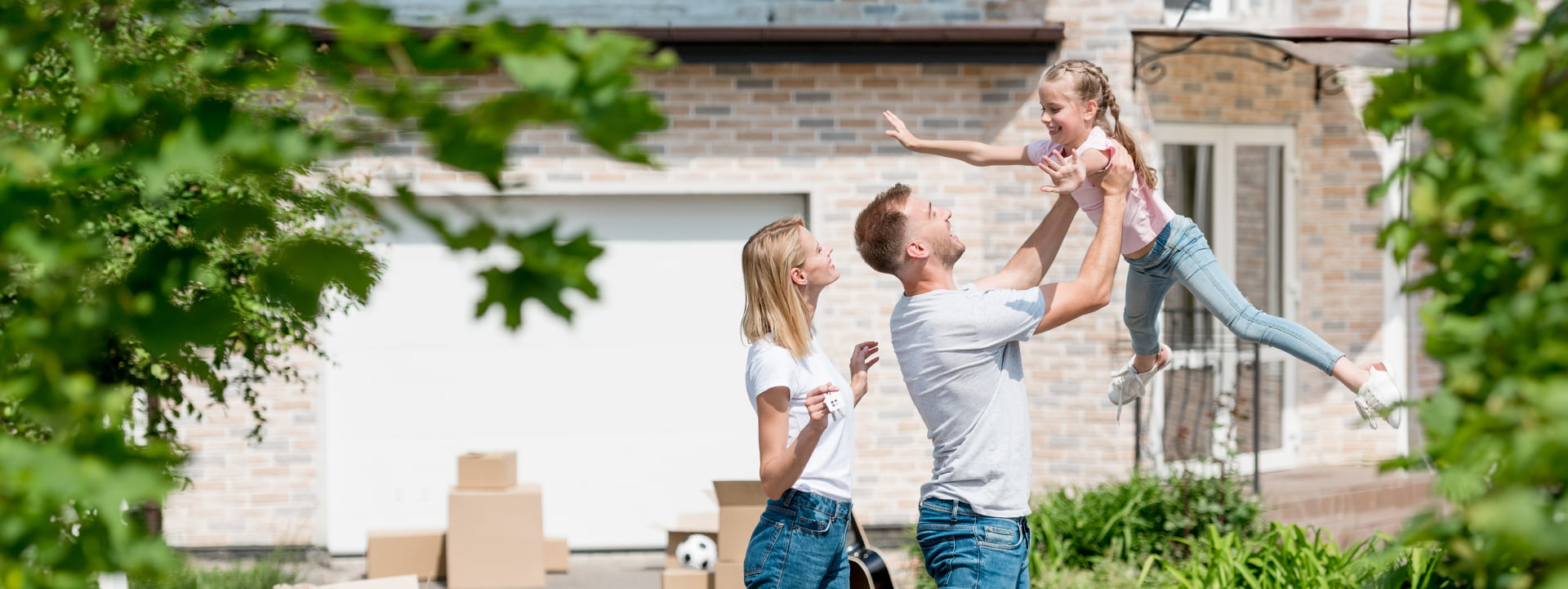 Palm Coast FHA Loans happy family outside new home