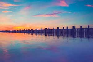 dock over the water during sunset in great neck new york